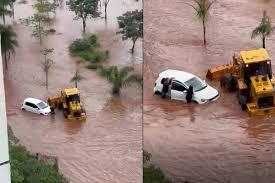Família presa em enxurrada é resgatada em trator em Campo Grande