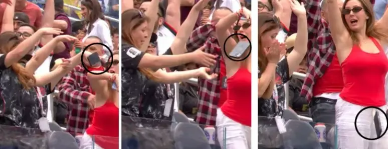 Torcedora se empolga na 'ola' e 'arremessa' o celular no jogo entre Canadá e África do Sul
