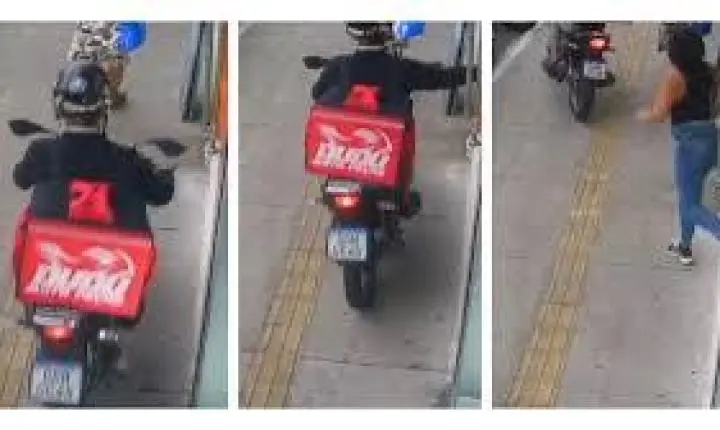 VÍDEO: Falso entregador em moto sobe na calçada e rouba celular de mulher na porta de loja em SP