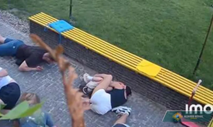 VÍDEO: Mulher viraliza após proteger menina durante bombardeio russo contra cidade na Ucrânia